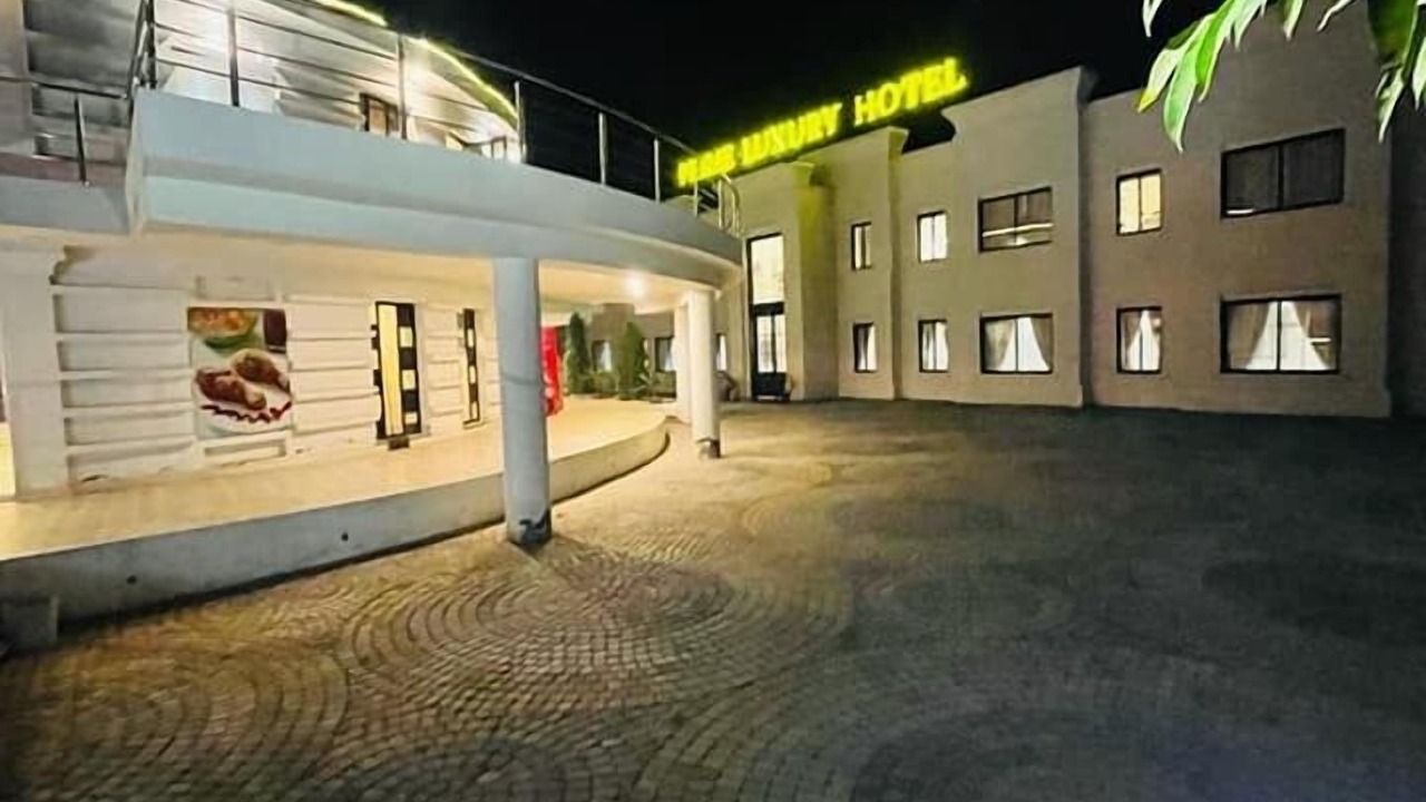 Primecastle Luxury Hotel exterior at night